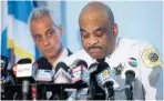  ?? JOSHUA LOTT/GETTY IMAGES ?? Chicago Mayor Rahm Emanuel, left, listens as Chicago Police Superinten­dent Eddie Johnson speaks about Chicago's weekend of gun violence.