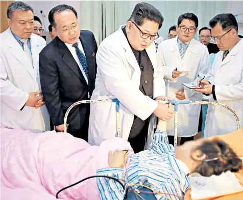  ??  ?? Kim Jong-un meets survivors of a bus crash that left 32 dead, most of them Chinese citizens. The North Korean leader reportedly said he ‘couldn’t control his grief’