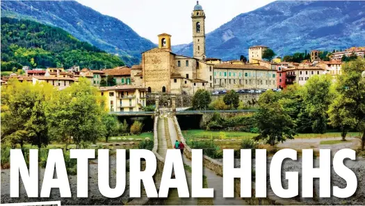  ?? ?? Dramatic: A classic hillside town in the Trebbia Valley and, inset, a woman tries rock climbing