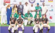  ?? ?? Lagos State governor, Babajide Sanwo-Olu, poses with the players of Trojan Ark team and STL team with other officials.