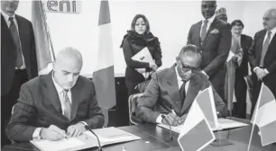  ??  ?? Minister of State for Petroleum Resources, Dr. Emmanuel Ibe Kachikwu (right) signing the MOU on behalf of Nigeria, while Mr. Claudio Descalzi (left) the Chief Executive Officer Eni, signed on behalf of Eni on the rehabilita­tion of the Port Harcourt...