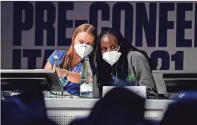  ?? Italy. CLAUDIO FURLAN/AP ?? Climate activists Greta Thunberg, left, of Sweden and Vanessa Nakate of Uganda attend a youth climate summit Tuesday in Milan,