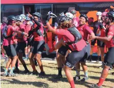  ?? ?? Cyclists taking part in the Absa Cape Epic training camp dance in celebratio­n at the handover of the library.
