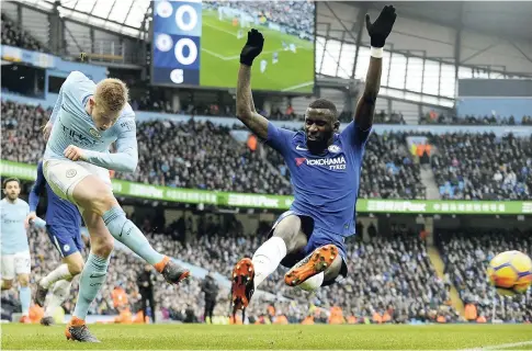  ?? AP ?? Manchester City’s Kevin De Bruyne (left) tries to score as Chelsea’s Antonio Rudiger defends during their English Premier League match at the Etihad Stadium in Manchester, England, yesterday.