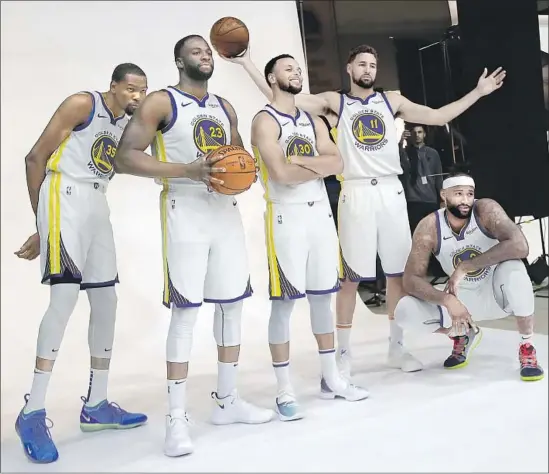  ?? Jeff Chiu Associated Press ?? KEVIN DURANT, left, Draymond Green, Stephen Curry, Klay Thompson and the rehabbing DeMarcus Cousins make the Warriors the clear favorites in the NBA.