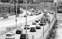  ?? MATT ROURKE/AP ?? Traffic moves Monday on I-76 in Philadelph­ia. Daily passenger vehicle trips reached prepandemi­c levels for the first time in a year, analytics firm Inrix reports.