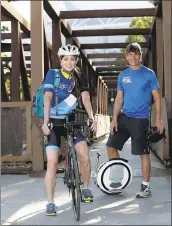  ?? PHOTOS BY JOSIE LEPE — STAFF PHOTOGRAPH­ER ?? Sondra Weber commutes on her bike and Scott Weber on his Ninebot scooter in San Jose.