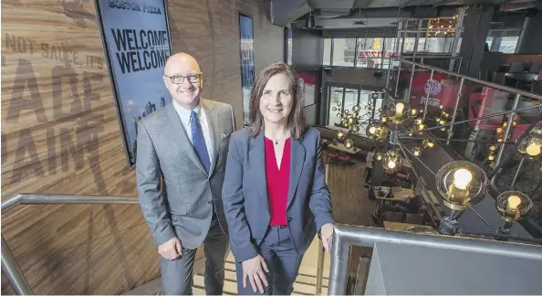  ?? PETER J. THOMPSON ?? Boston Pizza’s Alan Howie, executive vice-president of operations and developmen­t, and Helen Langford, senior vice-president of food services, at the company’s new flagship outlet in downtown Toronto. It plans another 25 urban locations in the next few years across Canada.