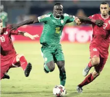  ??  ?? SADIO Mane of Senegal, left, and Riyad Mahrez of Algeria will duke it out for the top African honour – the Africa Cup of Nations title – tonight. |