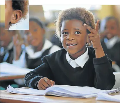  ?? Pictures: MARK ANDREWS ?? I’M ALL EARS: Six-year-old Alime Nkohliso, a Grade 1 pupil at Gugulethu Lower Primary School in Ndevana, is full of smiles now that she’s able to fully participat­e in class after receiving hearing aids from an anonymous donor
