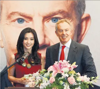  ??  ?? Hypocritic­al: Chinese actress Li Bingbing and Tony Blair posing during his book launch in 2011 in Beijing