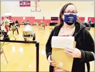  ?? Peter Hvizdak / Hearst Connecticu­t Media ?? Sixth-grade bilingual teacher Ingrid Cuevas of the Fair Haven School in New Haven waits in line to receive her vaccinatio­n at Wilbur Cross High.