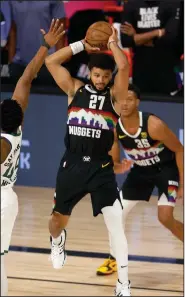  ?? (AP/Mike Ehrmann) ?? Jamal Murray of the Denver Nuggets scored 33 of his team-high 42 points in the second half as the Nuggets defeated the Utah Jazz 117-107 to avoid eliminatio­n and force Game 6 on Thursday night.