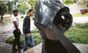  ?? Photos by Marie D. De Jesús / Staff photograph­er ?? Gerrol Johnson, 19, and his friend Everette Latson, 19, study Raymond DuchampVil­lon’s “The Large Horse.” Above: Detail of Emile-Antoine Bourdelle’s “Adam.”