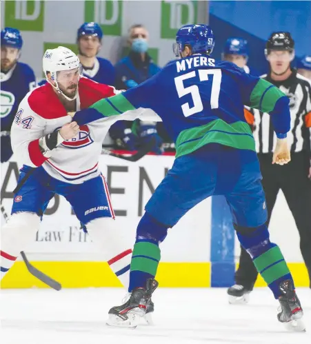  ?? JASON PAYNE ?? The Canucks' Tyler Myers squares off with Montreal's Joel Edmundson at Rogers Arena on Saturday night. The fight, agreed to by the two players, was meant to settle the score after Myers levelled a devastatin­g hit on the Canadiens Joel Armia near the end of the game Thursday night.