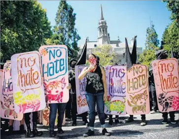  ?? Marcus Yam Los Angeles Times ?? QUESTIONS about free speech took on new urgency this year after violent protests at UC Davis and UC Berkeley. Above, members of the so-called black bloc hold up shields at a protest in Berkeley in August.