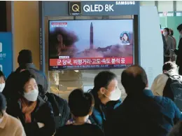  ?? AHN YOUNG-JOON/AP ?? A television screen shows a file image of a North Korean missile launch during a news program broadcast Friday at the Seoul Railway Station in Seoul, South Korea.