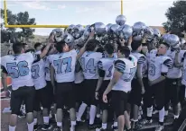  ?? ARCENIO J. TRUJILLO/THE TAOS NEWS ?? The Jaguars huddle after their preseason scrimmage against Taos on Aug. 18. Capital went 5-5 last year and finished 3-1 in District 2-5A, but hope to take the next step and win the district title and return to the state playoffs.