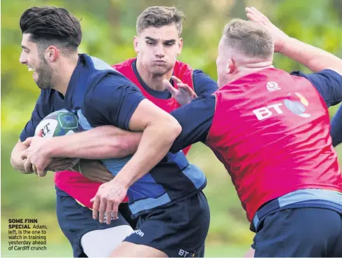  ??  ?? SOME FINN SPECIAL Adam, left, is the one to watch in training yesterday ahead of Cardiff crunch