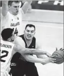  ?? SHAFKAT ANOWAR/AP ?? Loyola center Cameron Krutwig is pressured by Southern Illinois’ Steven Verplancke­n Jr. (22) and Kyler Filewich during the second half Saturday.