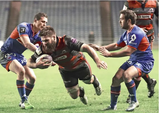  ??  ?? Too hot to handle: Cornell du Preez crosses for one of his two tries on a victorious night for Alan Solomons’ Edinburgh at BT Murrayfiel­d