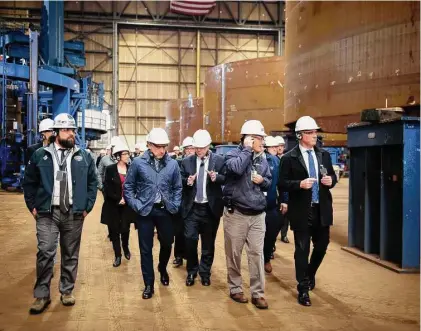  ?? Photo courtesy U.S. Embassy & Consulates in Australia ?? Australian officials tour a General Dynamic Electric Boat facility in Quonset Point, R.I., in December 2022. The country has committed to three Virginia-class subs, according to Reuters sources, with the option for two more.