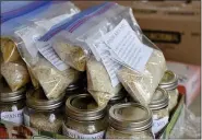  ??  ?? Spanish Rice mixes assembled by volunteers at the Immanuel United Church of Christ in Shillingto­n Monday morning January 18, 2021, during a program for Martin Luther King Jr. Day with the church and the Jewish Federation of Reading/Berks.