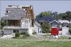  ?? GREENLEES / STAFF TY ?? Homes damaged by the Memorial Day tornado on Country View Lane in Clayton are shown, two months after the twister struck.