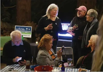  ?? CHRIS RILEY — TIMES-HERALD ?? Supervisor Erin Hannigan talks with supporters as she claims victory, keeping her District 1seat on Tuesday in Vallejo.