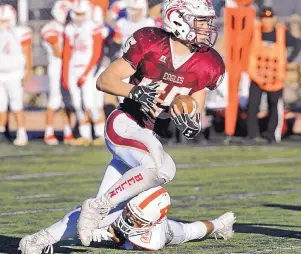  ?? JIM THOMPSON/JOURNAL ?? Belen running back Diego Casillas looks to the end zone after leaving Roswell’s Joel Sanchez in the dust. Casillas rushed for 302 yards in the Eagles’ Class 5A semifinal win.