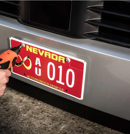  ??  ?? A worker in Nevada puts the finishing touches on the first autonomous truck allowed on public roads in the US.