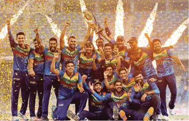  ?? (AFP) ?? Sri Lanka's players celebrate with the trophy after their victory against Pakistan in the final of Asia Cup in Dubai on Sunday