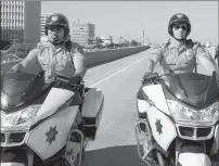  ?? Peter Iovino/Warner Bros. Pictures ?? Michael Peña, left, as Ponch and Dax Shepard as Jon star in the action comedy "CHiPs."
