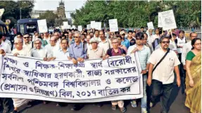  ?? ?? COLLEGE AND UNIVERSITY teachers protest in Kolkata in February 2017 demanding repeal of the West Bengal Universiti­es and Colleges (Administra­tion and Regulation) Act of 2017. The new Bills are seen as an extension of this Act.