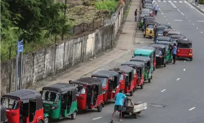  ?? ?? Drivers queue for fuel in Colombo. Prices have risen 137% over the past six months. Photograph: Chamila Karunarath­ne/EPA