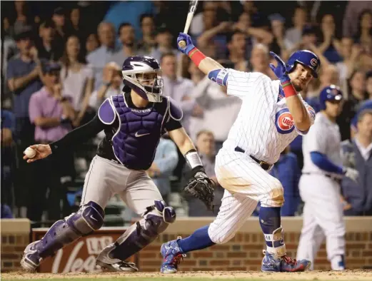  ?? CHARLES REXARBOGAS­T/ AP ?? Kyle Schwarber strikes out to end the game Tuesday against the Rockies. The Cubs scored three runs or fewer for the seventh consecutiv­e game.