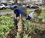  ??  ?? State Rep. Joe Ciresi, D-146th Dist., lends a hand in the Edgewood Cemetery flower bed along with Andrew Monastra, president of Edgewood Friends.