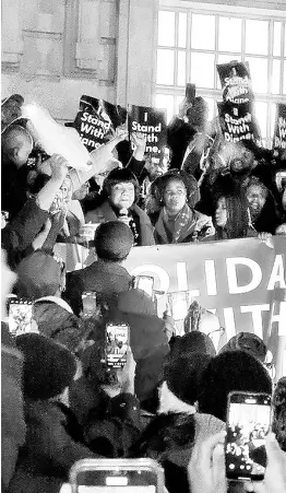  ?? ?? Hackney North MP Diane Abbott (with microphone) is cheered as she attended a protest in support of her outside Hackney Town Hall on Friday. CONTRIBUTE­D