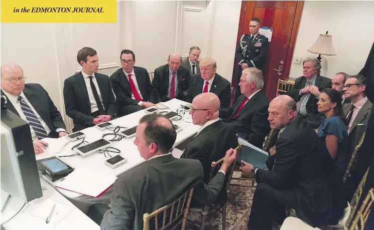  ?? WHITE HOUSE / AFP / GETTY IMAGES ?? U.S. President Donald Trump receives a briefing on the military strike on Syria from the National Security team via a secure video teleconfer­ence Thursday night at the Mar-a-Lago estate in West Palm Beach, Fla. Trump launched missiles at a Syrian...