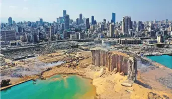  ?? AFP ?? An aerial view of the massive damage at Beirut port’s grain silos and the area around it yesterday, one day after a massive explosion hit the heart of the Lebanese capital.