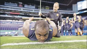  ?? THE CANADIAN PRESS ?? Mississipp­i State offensive lineman Justin Senior is measured for flexibilit­y at the NFL football scouting combine in Indianapol­is on March 3, 2017. Justin Senior isn’t growing weary with the process of becoming a profession­al football player. The...