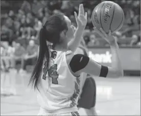  ?? Steph Miller ?? Callie White, shown above, lines up for a shot in the Indians fourth match-up against the Swedes. They ended their successful season with a close game, falling to Gothenburg 43-45. The Lady Indians have qualified for the state tournament two years in a row.