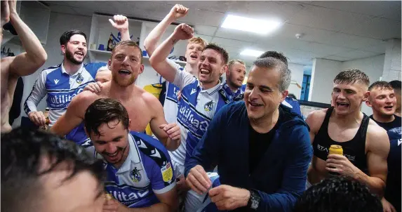  ?? Picture: Will Cooper/JMP ?? Bristol Rovers president Wael Al-Qadi celebrates promotion with the team in the dressing room after the win over Scunthorpe