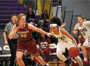  ?? ANNE NEBORAK — DIGITAL FIRST MEDIA ?? Porscha Speller of West Chester drives past Madison McHale of Lock Haven on Saturday.