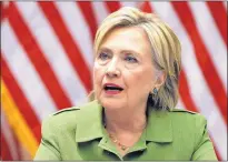  ?? CAROLYN KASTER/ASSOCIATED PRESS ?? Democratic presidenti­al candidate Hillary Clinton talks with media as she meets with law enforcemen­t leaders at John Jay College of Criminal Justice Thursday in New York.