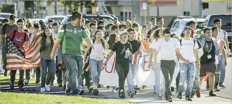  ?? Irfan Khan Los Angeles Times ?? STUDENTS in South Gate protest the election of Donald Trump last month. His election has inspired talk of California’s seceding from the U.S., organized under the banner of the Yes California Independen­ce Campaign and heralded by the Twitter hashtag...