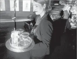  ?? Jay L. Clendenin Los Angeles Times ?? THE FOOD AND BEVERAGE services sector added 53,000 positions in July. Above, bartender Laura Lindsay delivers drinks in Studio City in 2016.