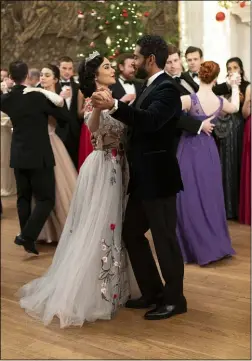  ??  ?? Margaret (Vanessa Hudgens) and Kevin reconnect during a dance in a scene from “The Princess Switch: Switched Again.”