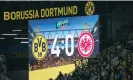  ?? Photograph: Martin Meissner/AP ?? The screen shows the 4-0 scoreline in added time during Borussia Dortmund’s victory against Eintracht Frankfurt.