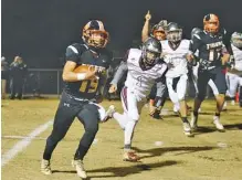  ?? STAFF PHOTO BY DOUG STRICKLAND ?? Meigs County junior quarterbac­k Aaron Swafford runs for a touchdown during a Class 2A state quarterfin­al against South Greene on Nov. 16 in Decatur, Tenn. On Sunday, Swafford was among the 10 Tennessee high school players named Mr. Football for 2018.